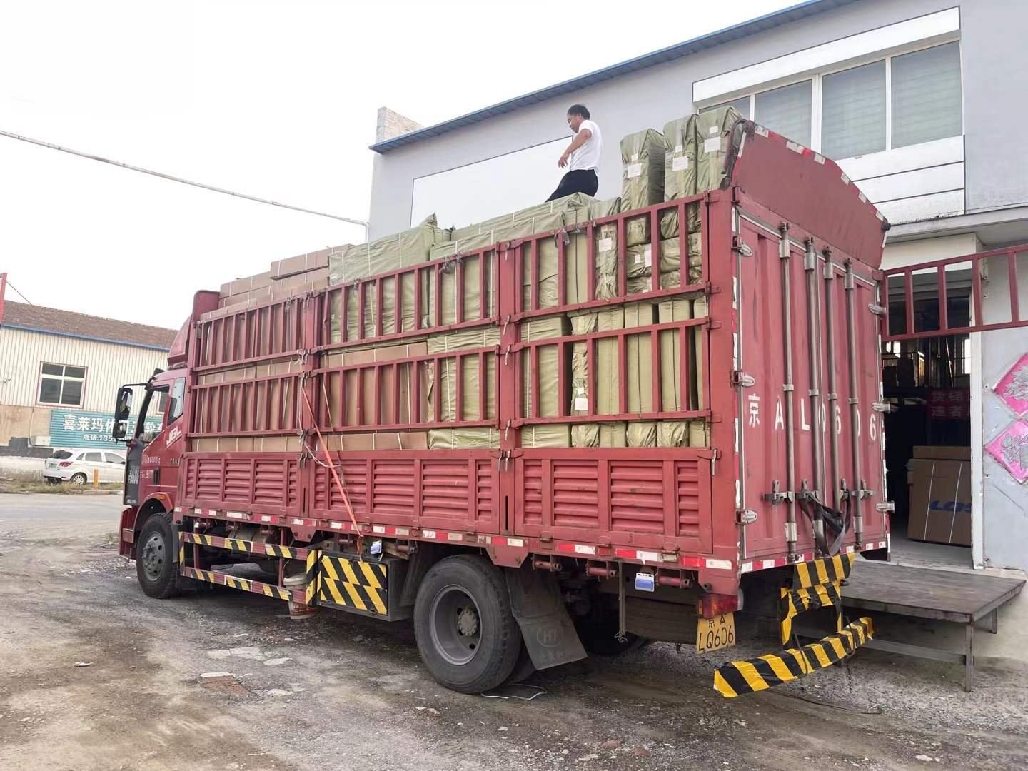 Bulk cartons loaded and secured on a freight truck